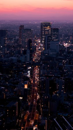 Aerial view of city buildings during night time скачать фон 2160 x 3840
