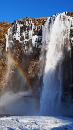 Исландия водопад снег